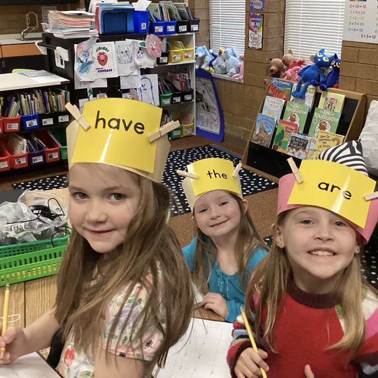 We are practicing reading and writing our tricky words by playing the headband game! 