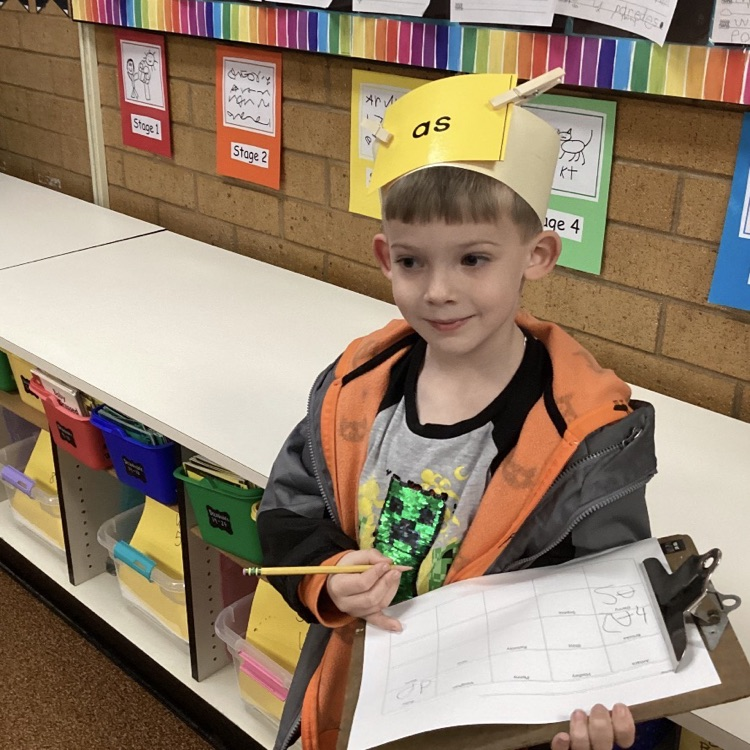 We are practicing reading and writing our tricky words by playing the headband game! 