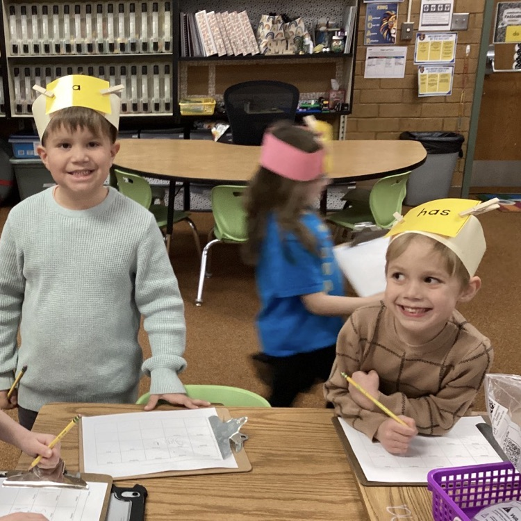 We are practicing reading and writing our tricky words by playing the headband game! 