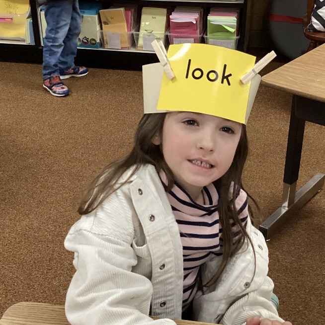 We are practicing reading and writing our tricky words by playing the headband game! 