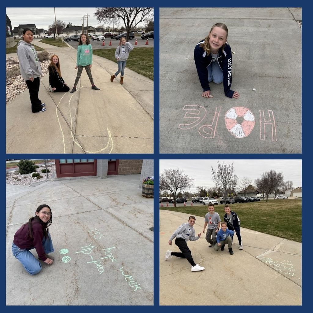 Students draw with chalk messages of Hope.
