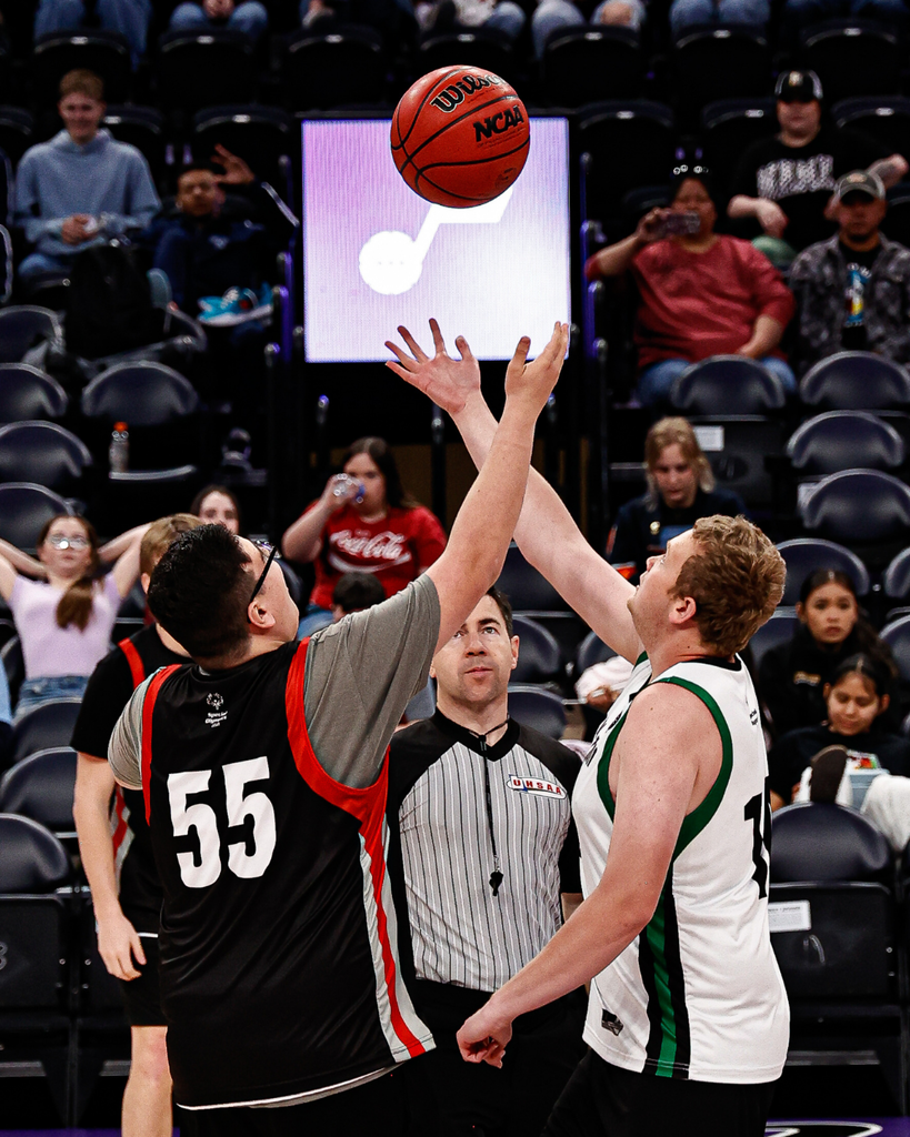 Students have their arms up ready for the Unified State Basketball Tipoff.