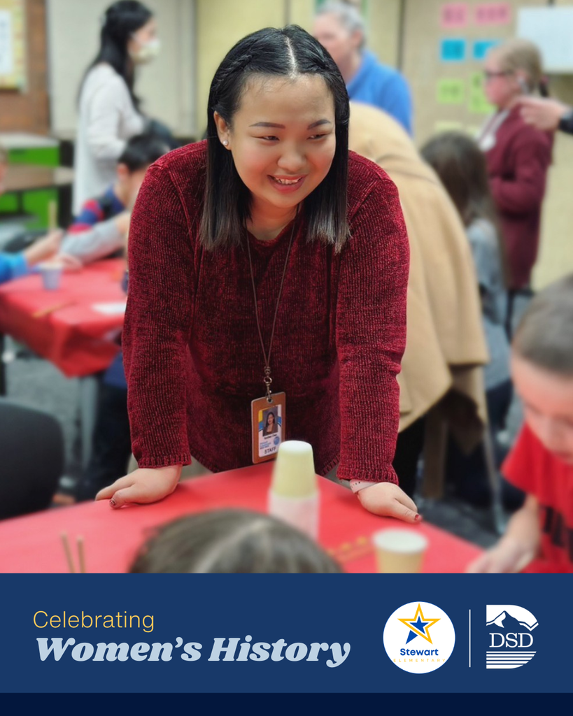 A teacher engaging with students. A banner that reads: "Celebrating Women's History"  with the Stewart Elementary and Davis School District Logos.