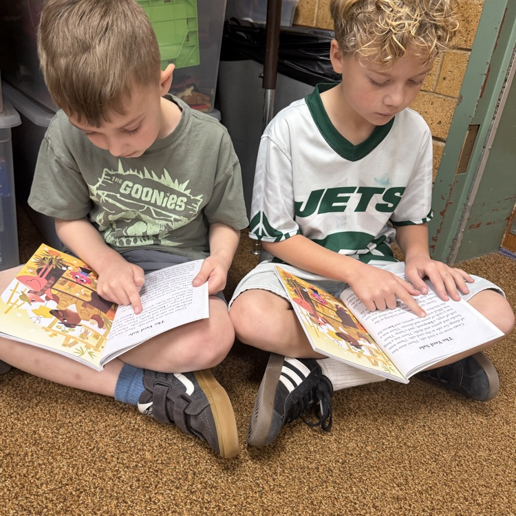 1st graders partner reading to practice fluency