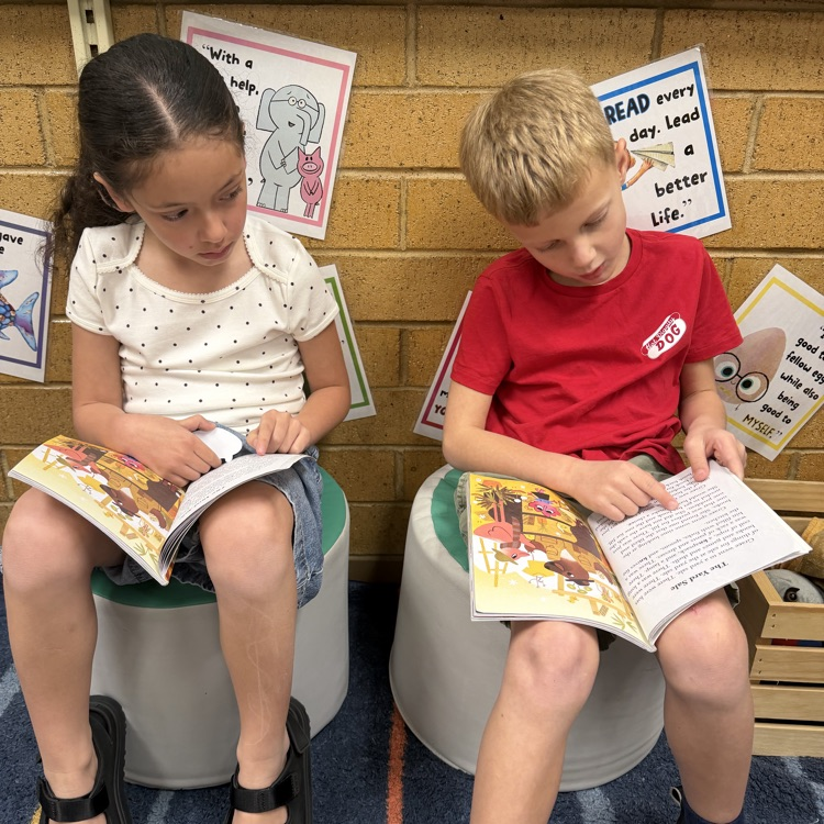 1st graders partner reading to practice fluency