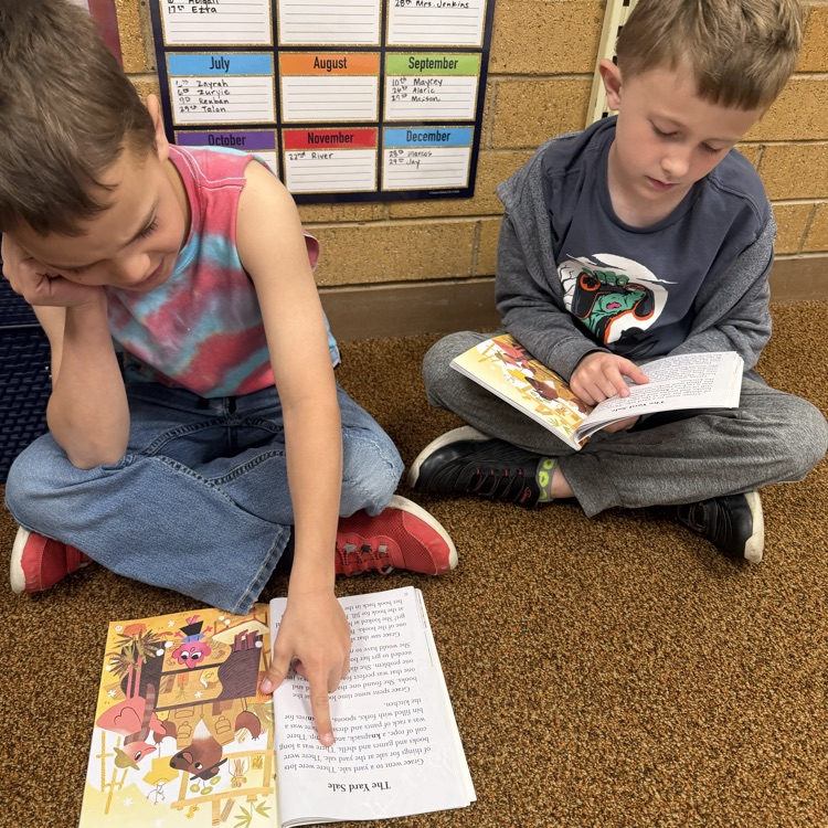 1st graders partner reading to practice fluency