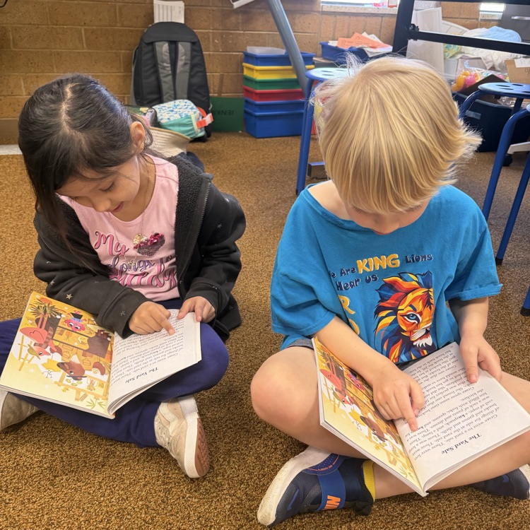 1st graders partner reading to practice fluency