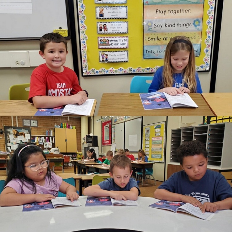 1st graders reading together with a partner to practice their skills