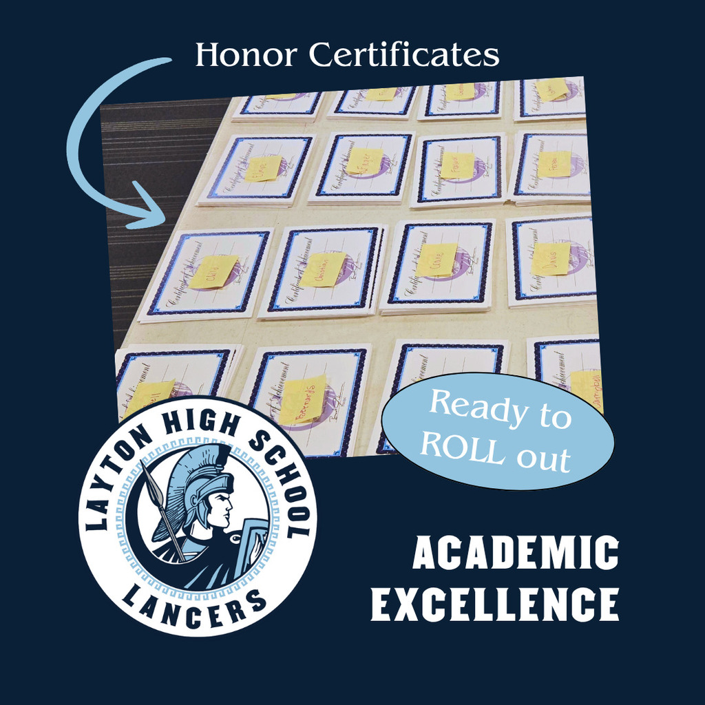 A picture showing a tableful of honor roll certificates stating that they are ready to roll out for Layton high school