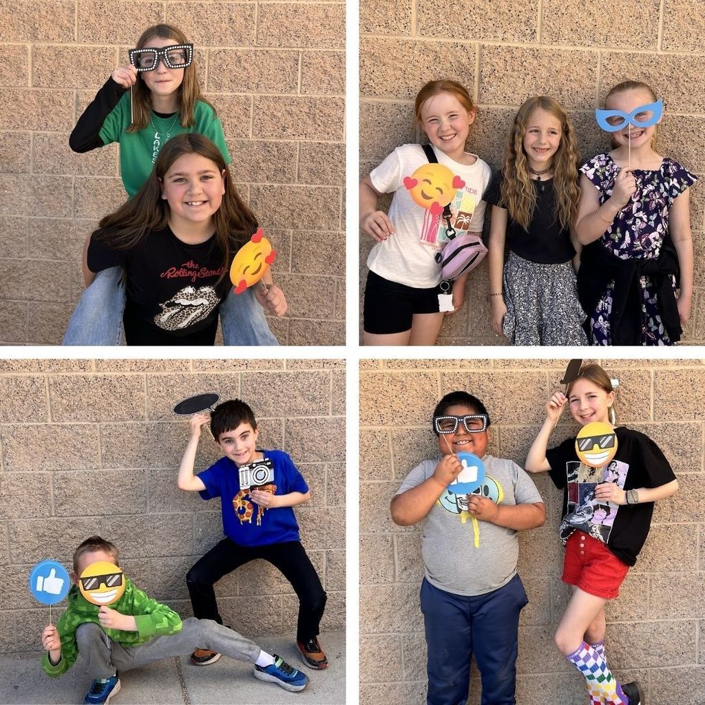 Students pose with fun props out at recess.