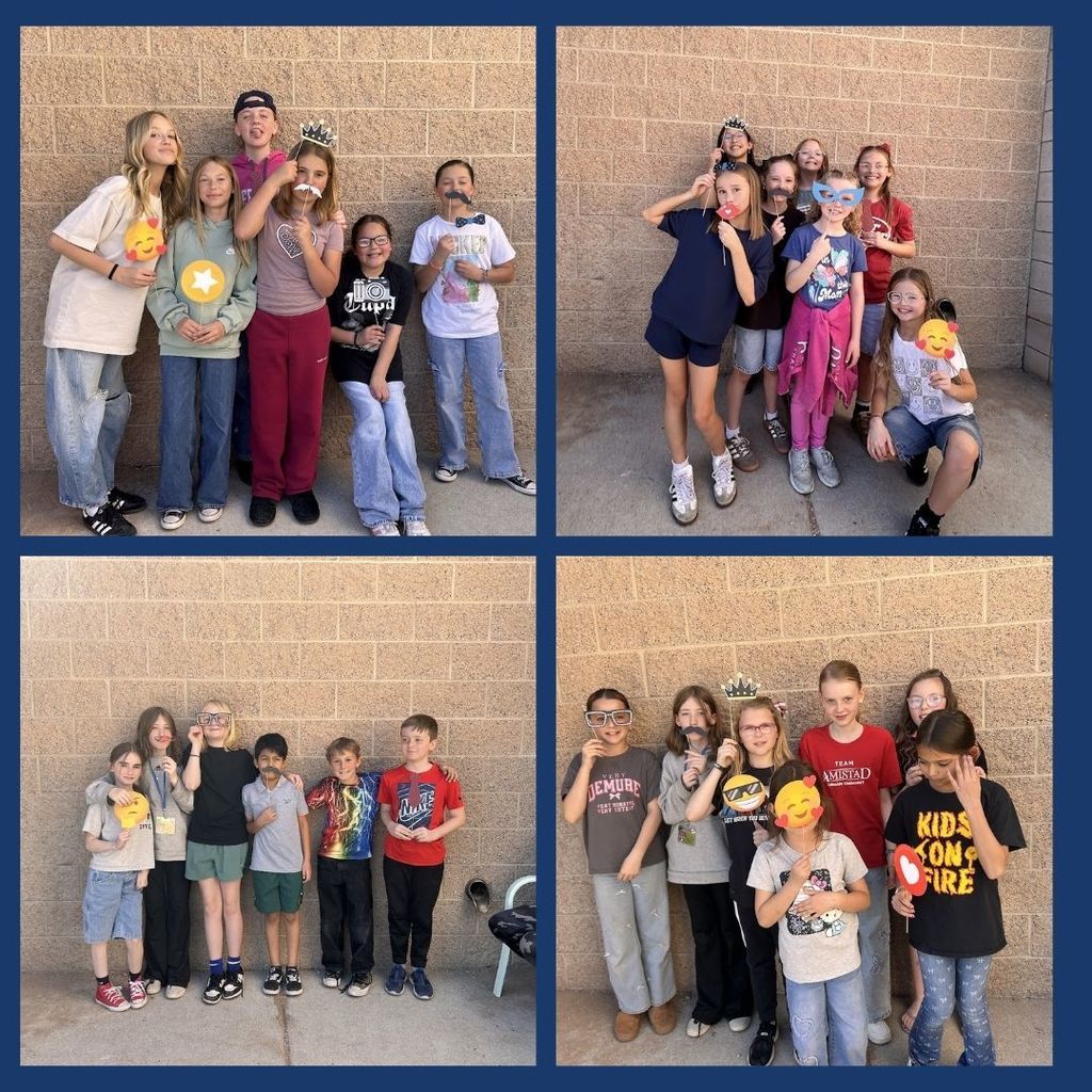Students pose with fun props out at recess.
