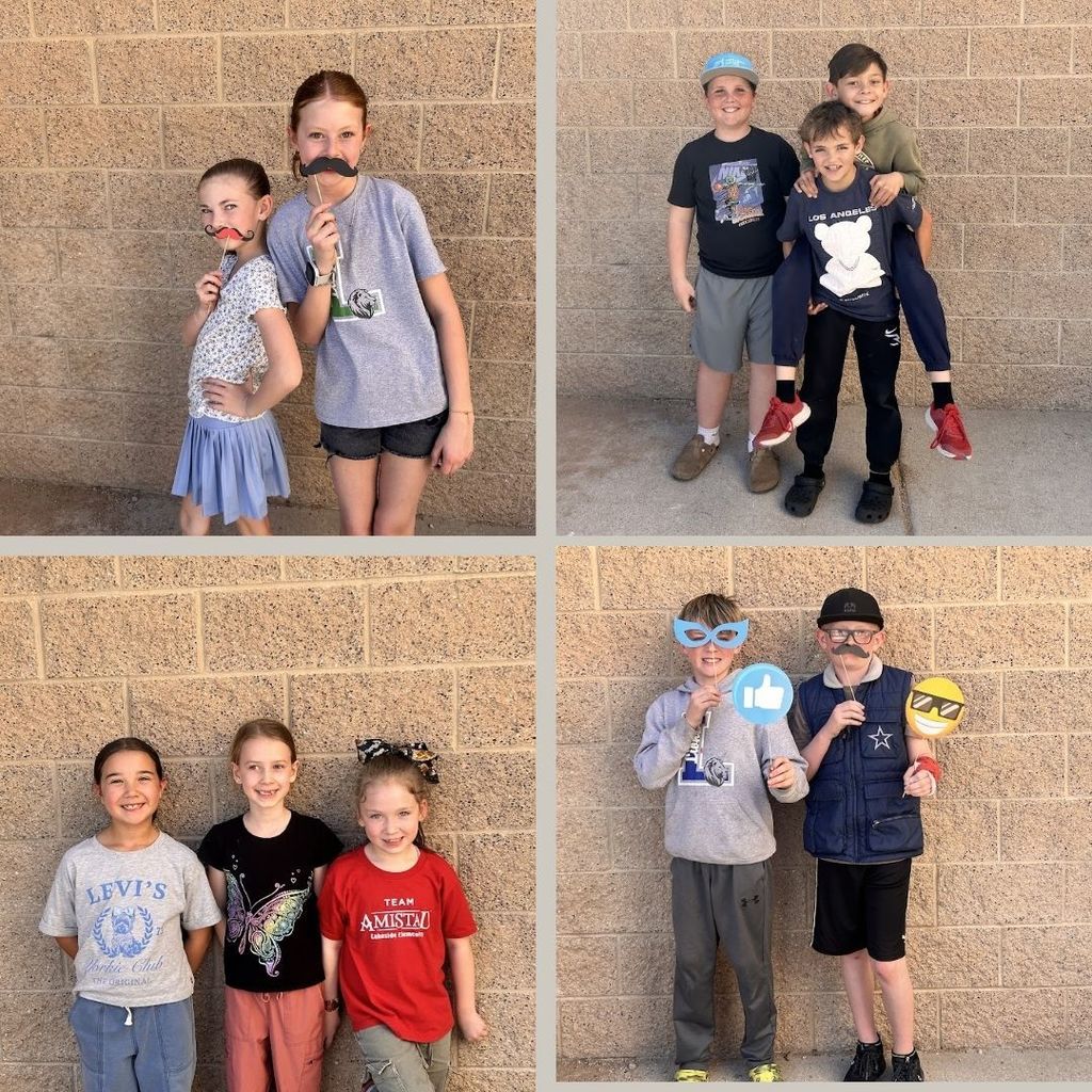 Students pose with fun props out at recess.