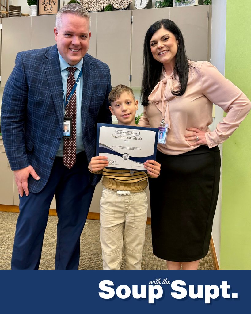 A student smiling with their principal and Dr. Linford, Davis School District Superintendent. 