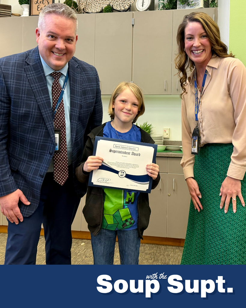 A student smiling with their principal and Dr. Linford, Davis School District Superintendent. 
