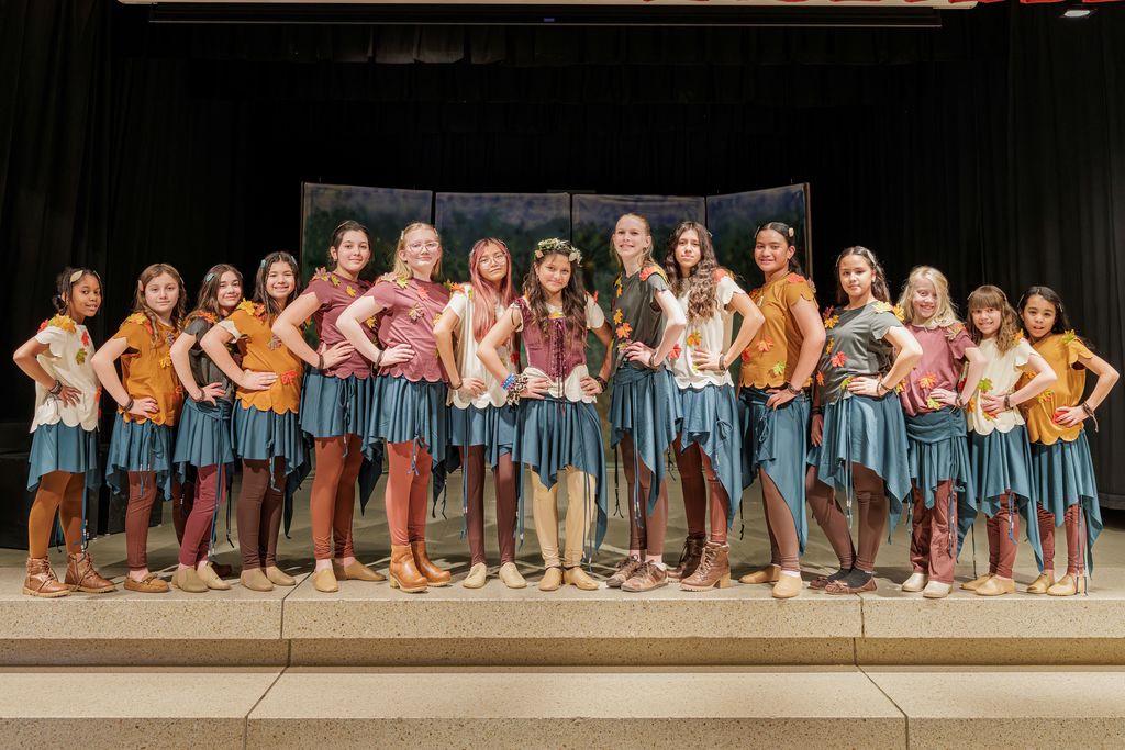 Tiger Lily and her brave girls on the stage at meadowbrook elementary