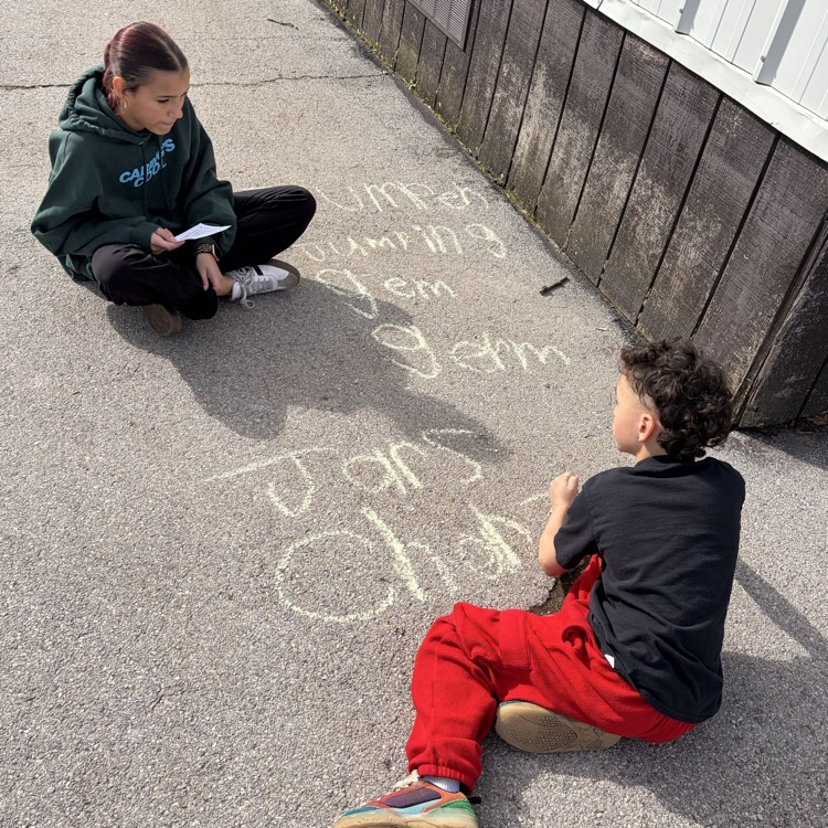 6th grade buddies helping with spelling words! 