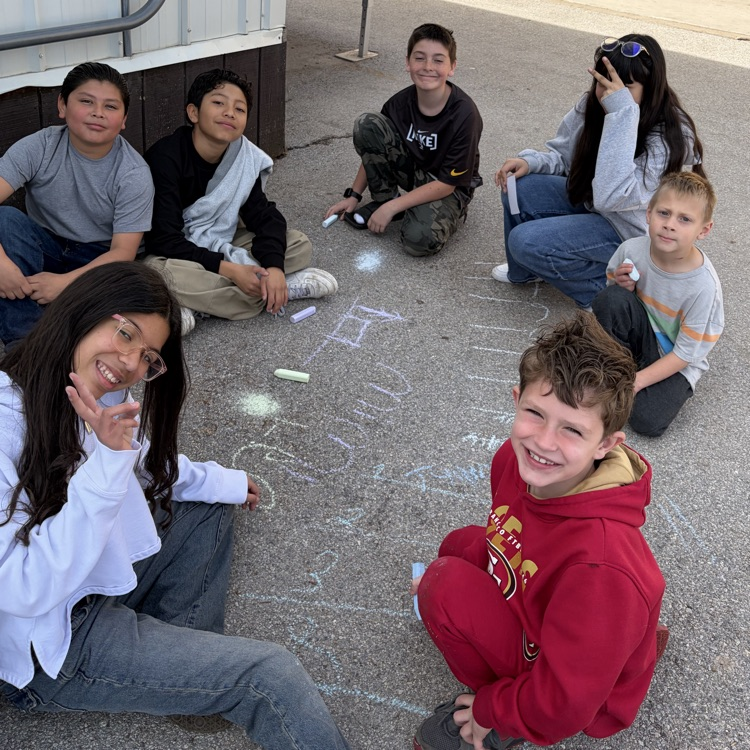 6th grade buddies helping with spelling words! 