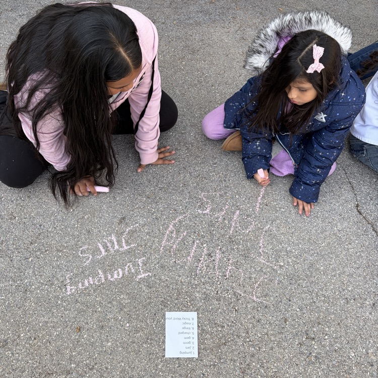 6th grade buddies helping with spelling words! 