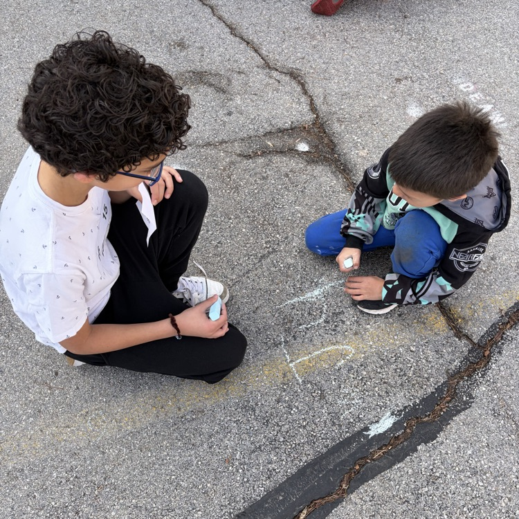 6th grade buddies helping with spelling words! 