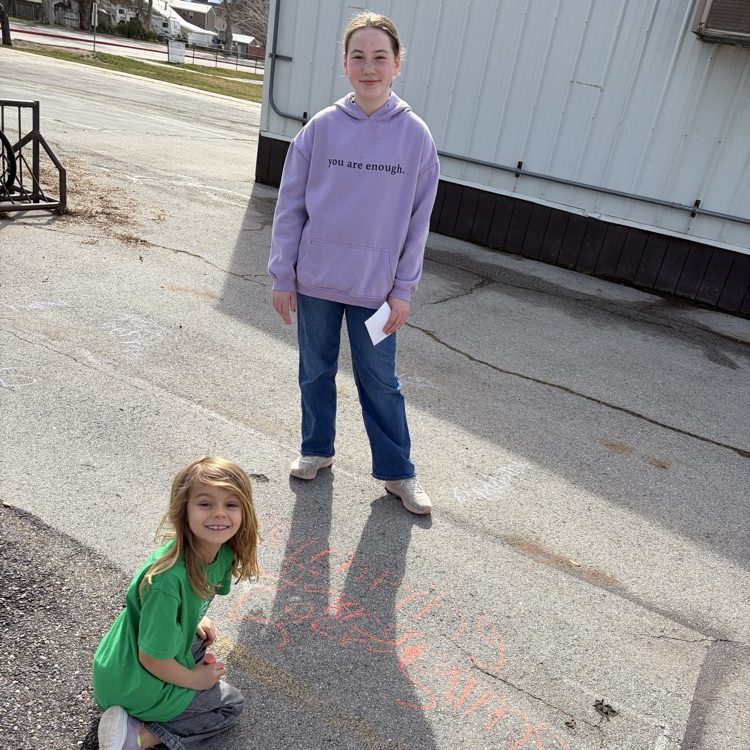 6th grade buddies helping with spelling words! 