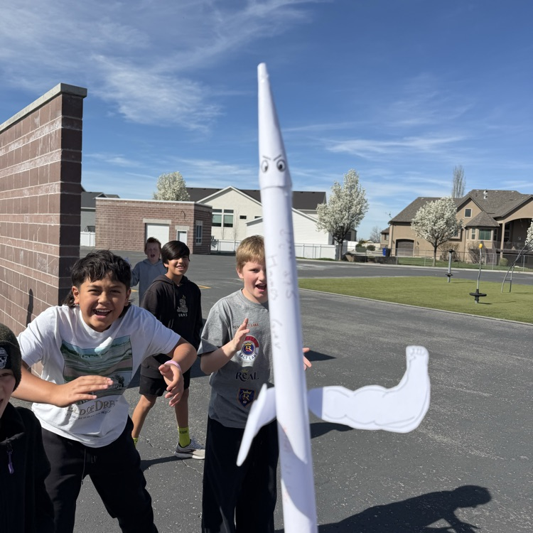 Student with paper rocket