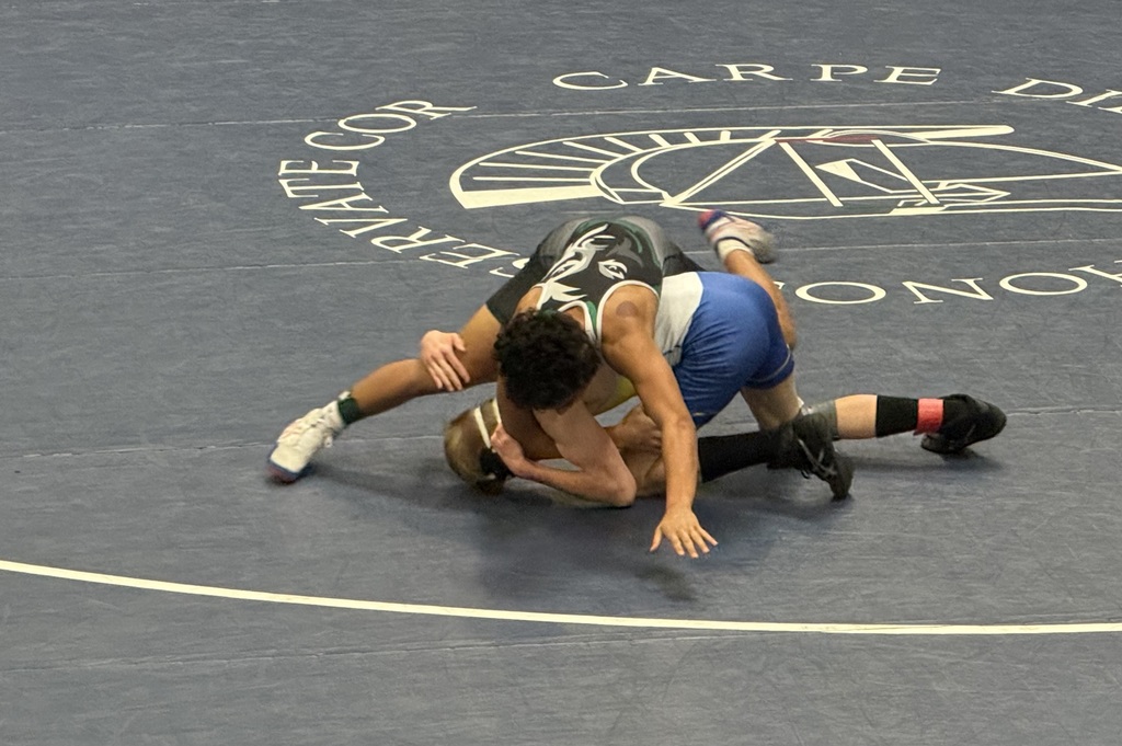 Another student wrestling at the District Championship. 