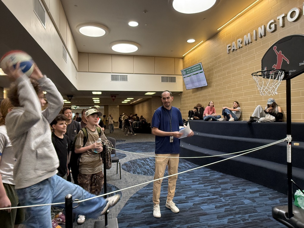 Student shooting a basket after identify a way to pay for college. 