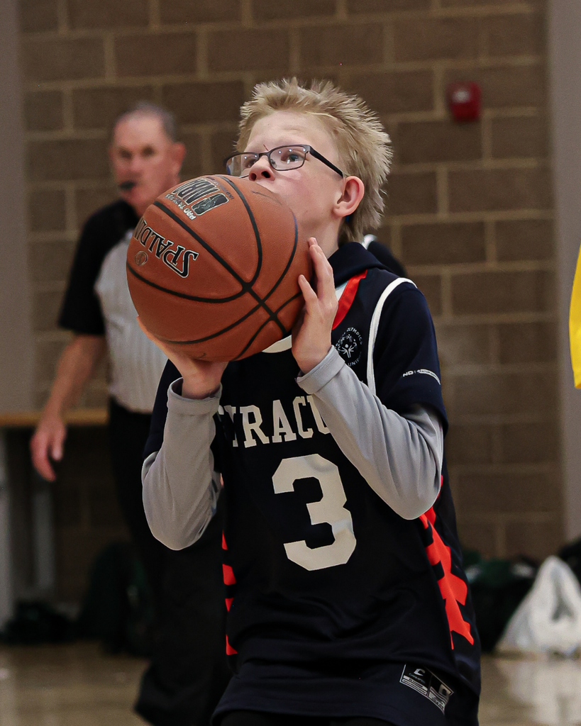 A Syracuse Junior High Student gets ready to shoot the basketball during a game. 