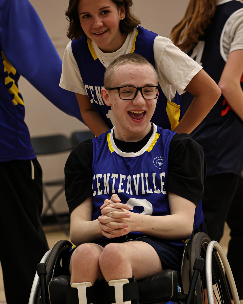 A centerville student smiles as she pushes another student in a wheelchair.