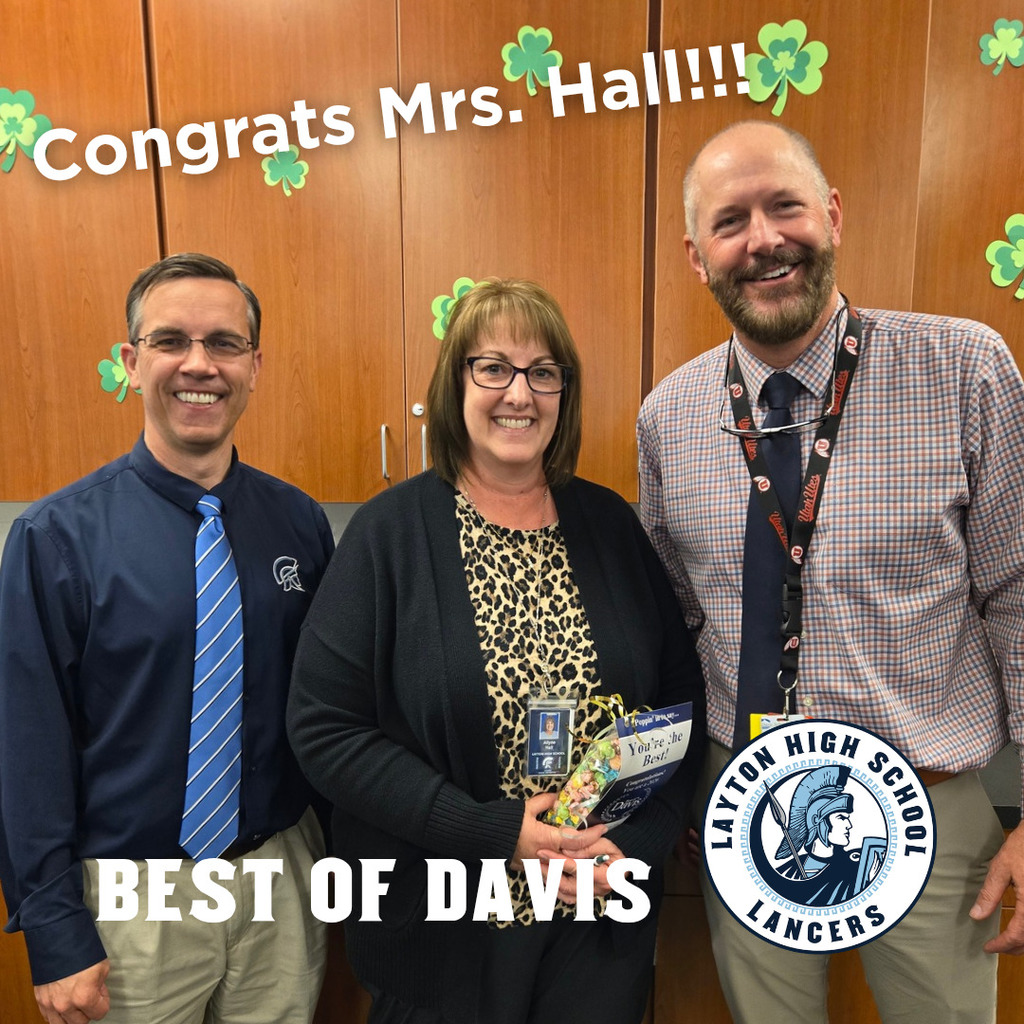 Mrs. Hall standing with Mr. Jackman and Mr. Smith after receiving her Best of Davis Award
