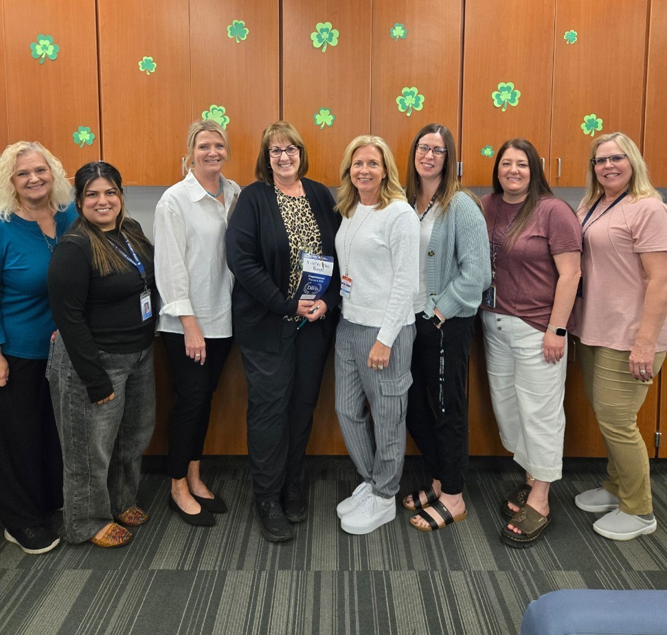 Mrs. Hall holding her Best of Davis award and standing with other counseling Center employees