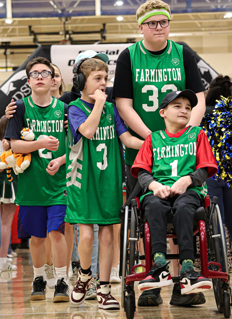 Part of the athletes on the Unified Sports Team waiting to play basketball.