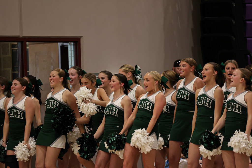 Cheerleaders cheering on the Unified Sports Team.