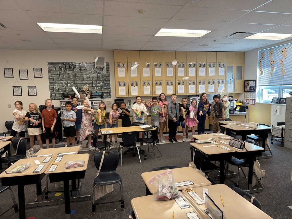 students throwing airplanes