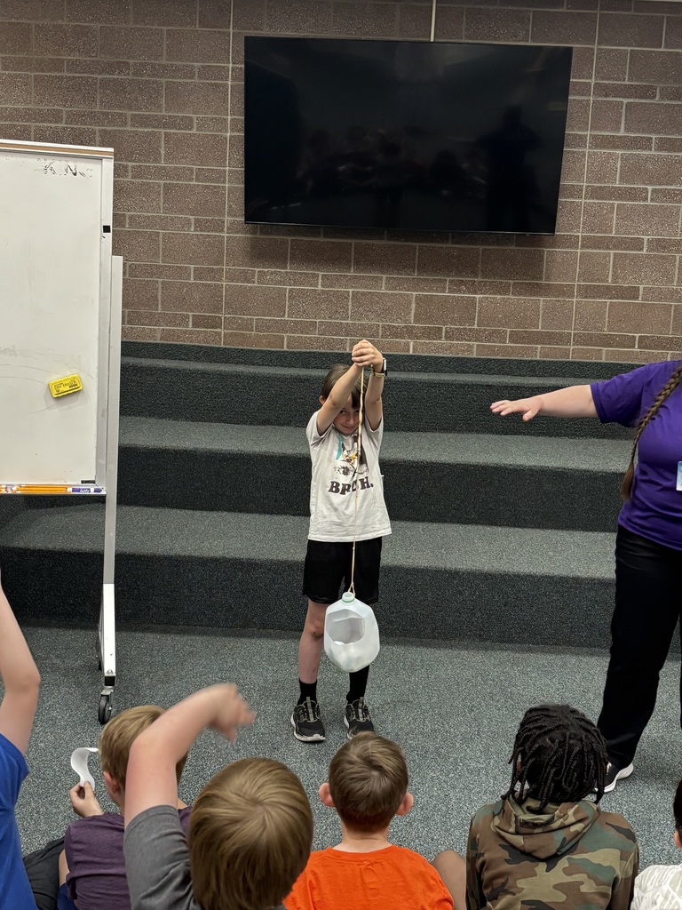 studnet participating in demonstration about newtons laws