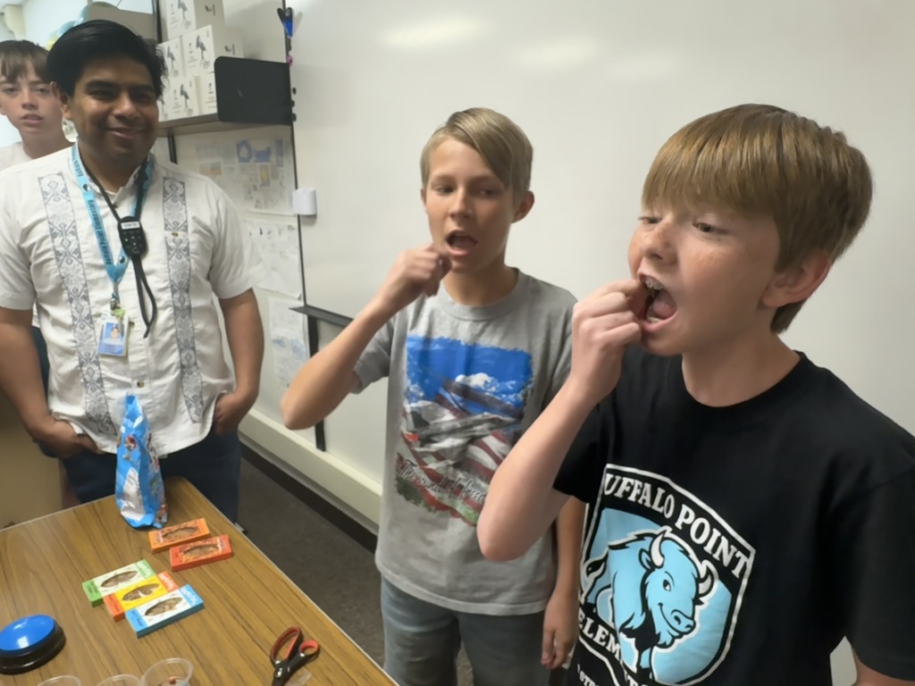 students eating worms