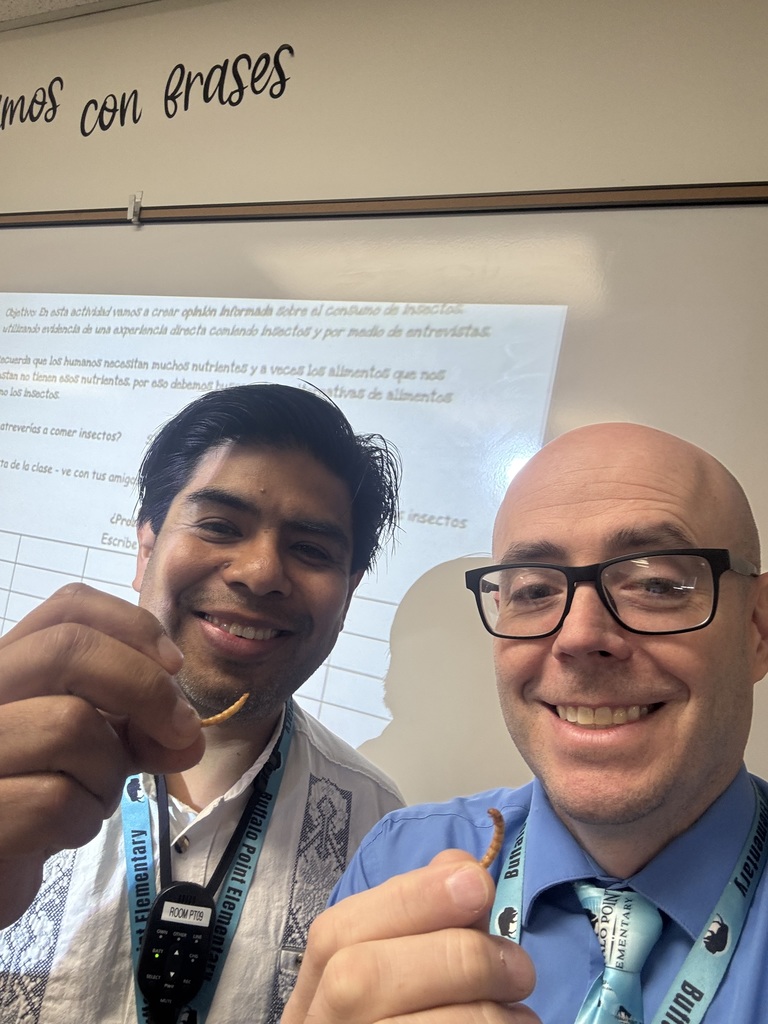 teacher and principal holding a worm