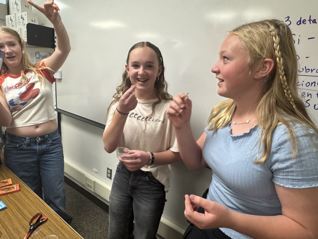 students eating worms