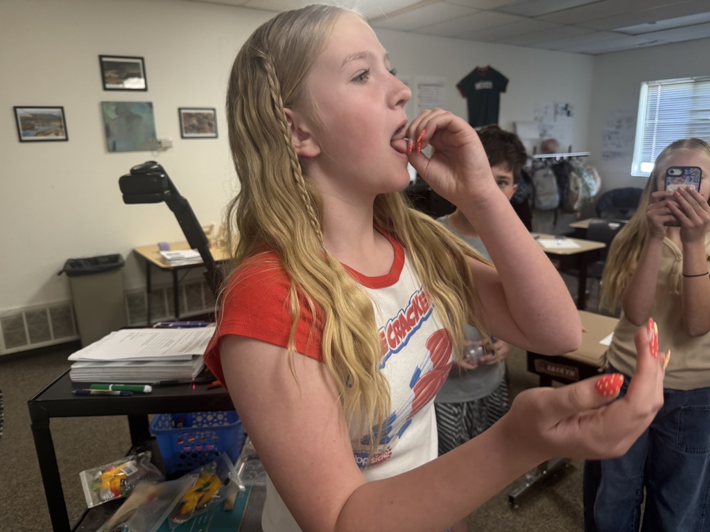 student eating a worm