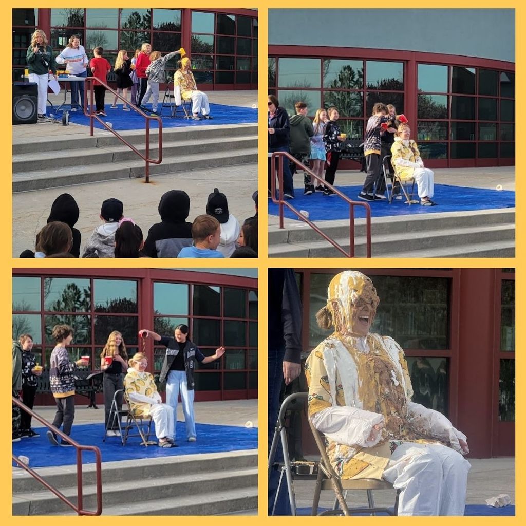 Principal drenched in taco topping and students adding more taco toppings.