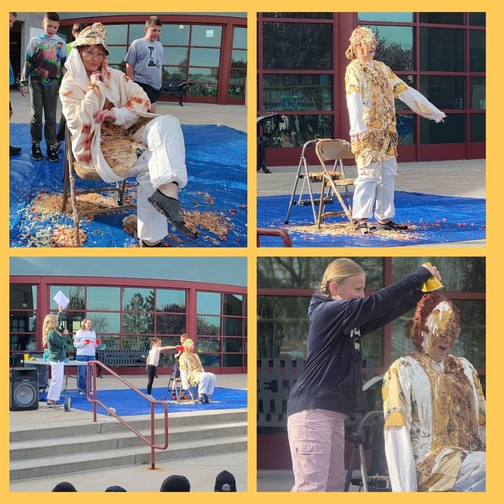 Principal drenched in taco topping and students adding more taco toppings.