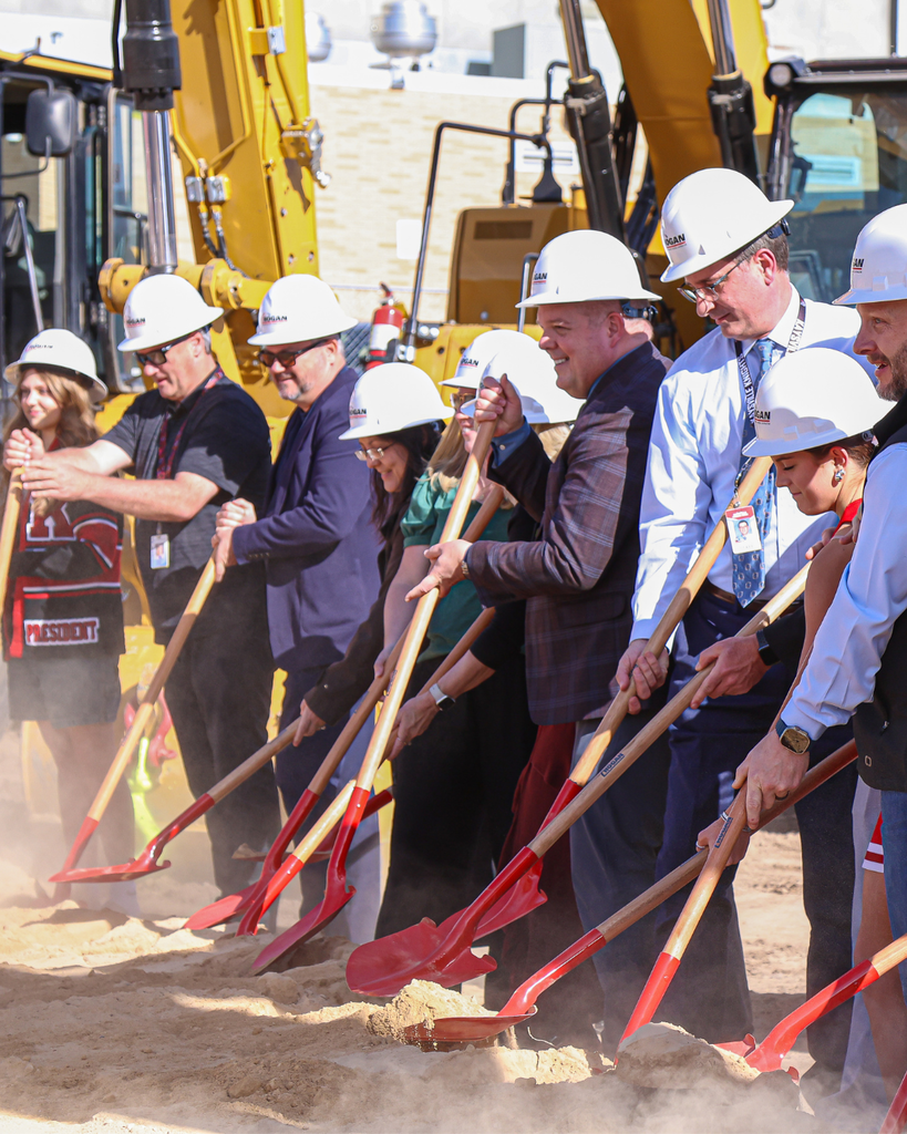 Many people turning over dirt for the Kaysville Field House Groundbreaking.