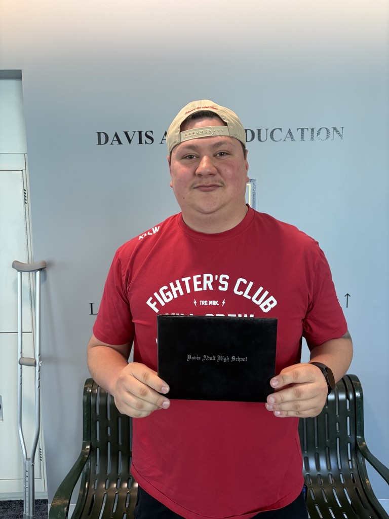 Jared Kane holding his diploma