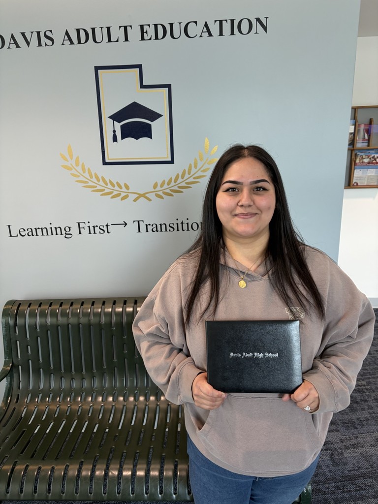 Alexia Cardenas holding a diploma