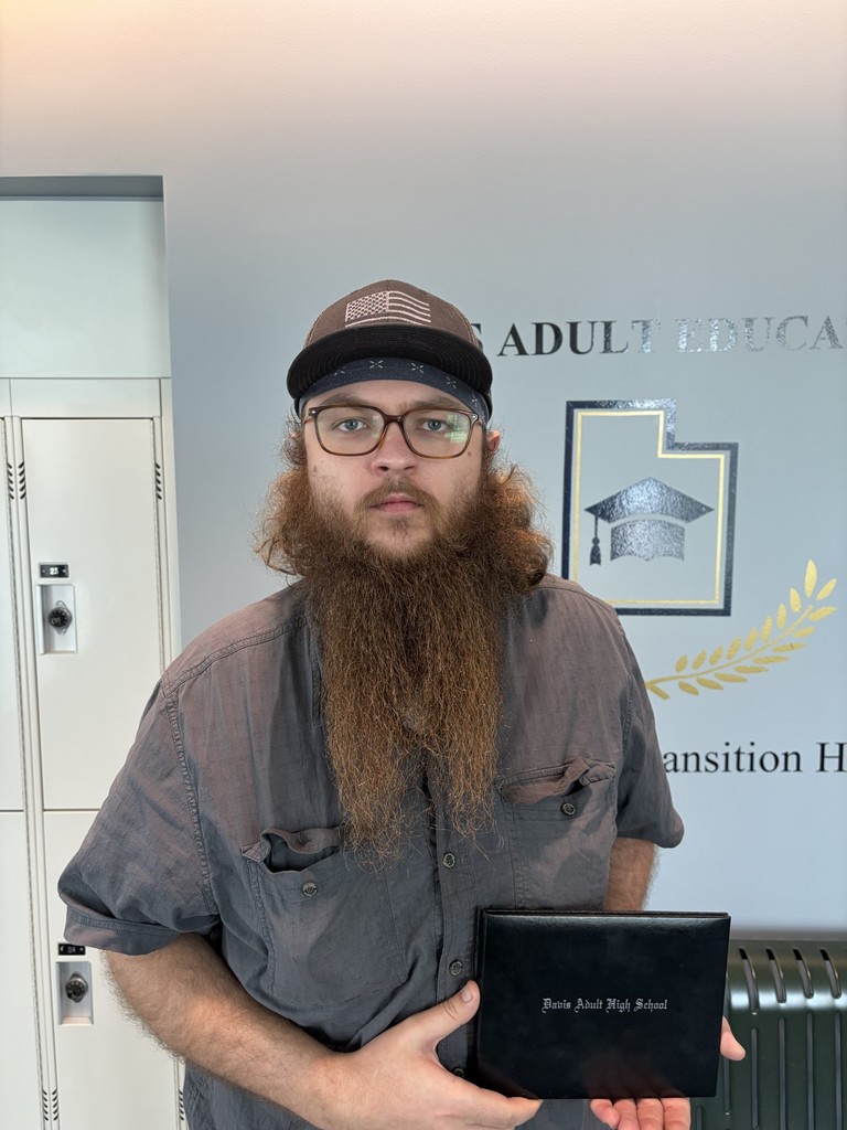 Anatoliy Savinkiy holding his diploma