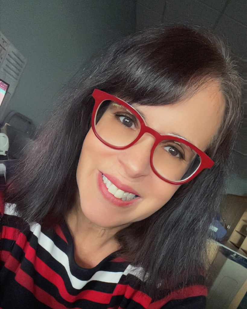 Mrs. Herbert wearing red glasses.