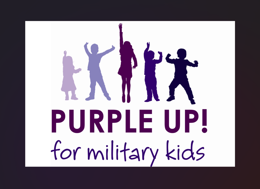 A graphic featuring the silhouettes of five children in various shades of purple, shown jumping and cheering with their arms raised in excitement. Below the silhouettes, large bold text reads "PURPLE UP!" in dark purple, followed by the phrase "for military kids" in a playful, purple handwritten font against a plain white background.