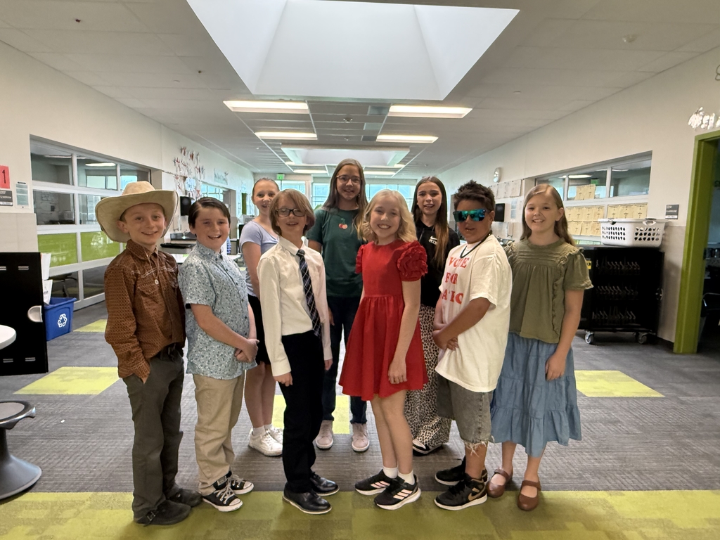 students pictured in the hallway of the school