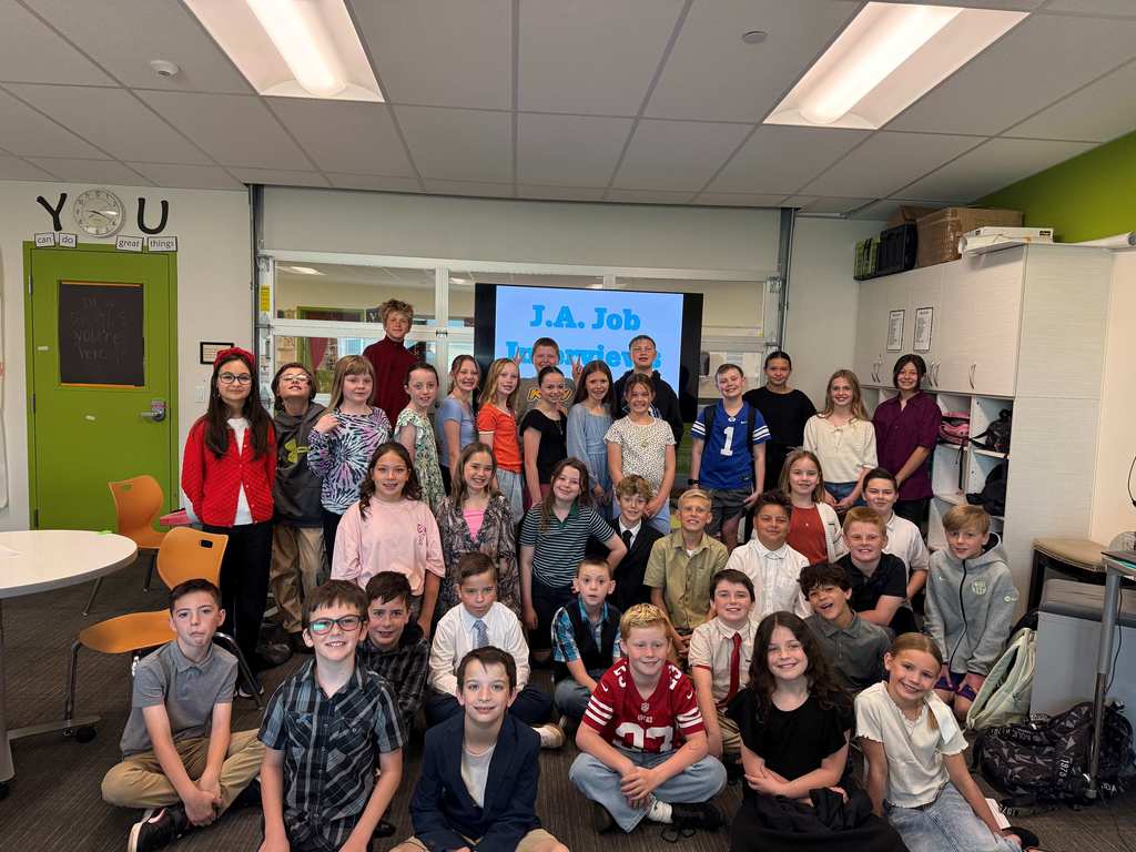 students pictured in the hallway of the school