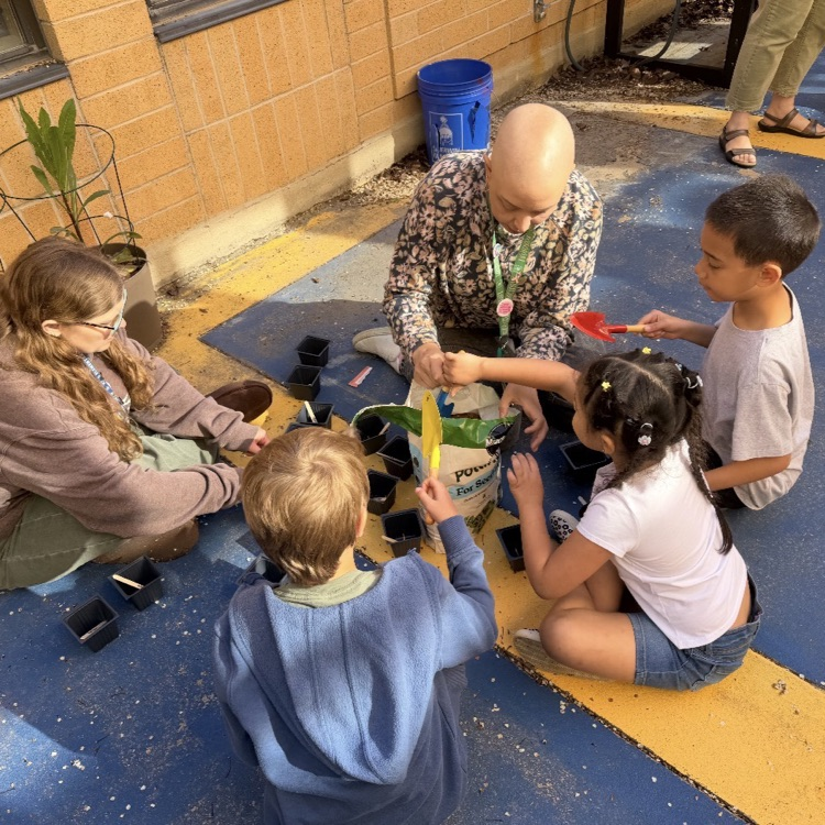Students in Kindergarten through 2nd grade ASC, learning about planting flowers and growing a garden. 